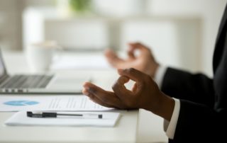 Man practicing business mindfulness at his desk