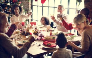 Family enjoying drama-free holidays at dinner table